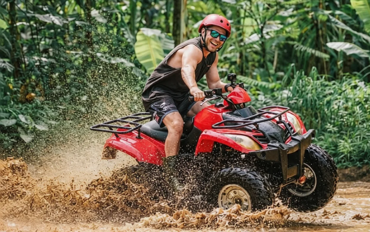 Ride Bali Adventure ATV rider crossing a muddy jungle track in Singapadu Kaler, Gianyar